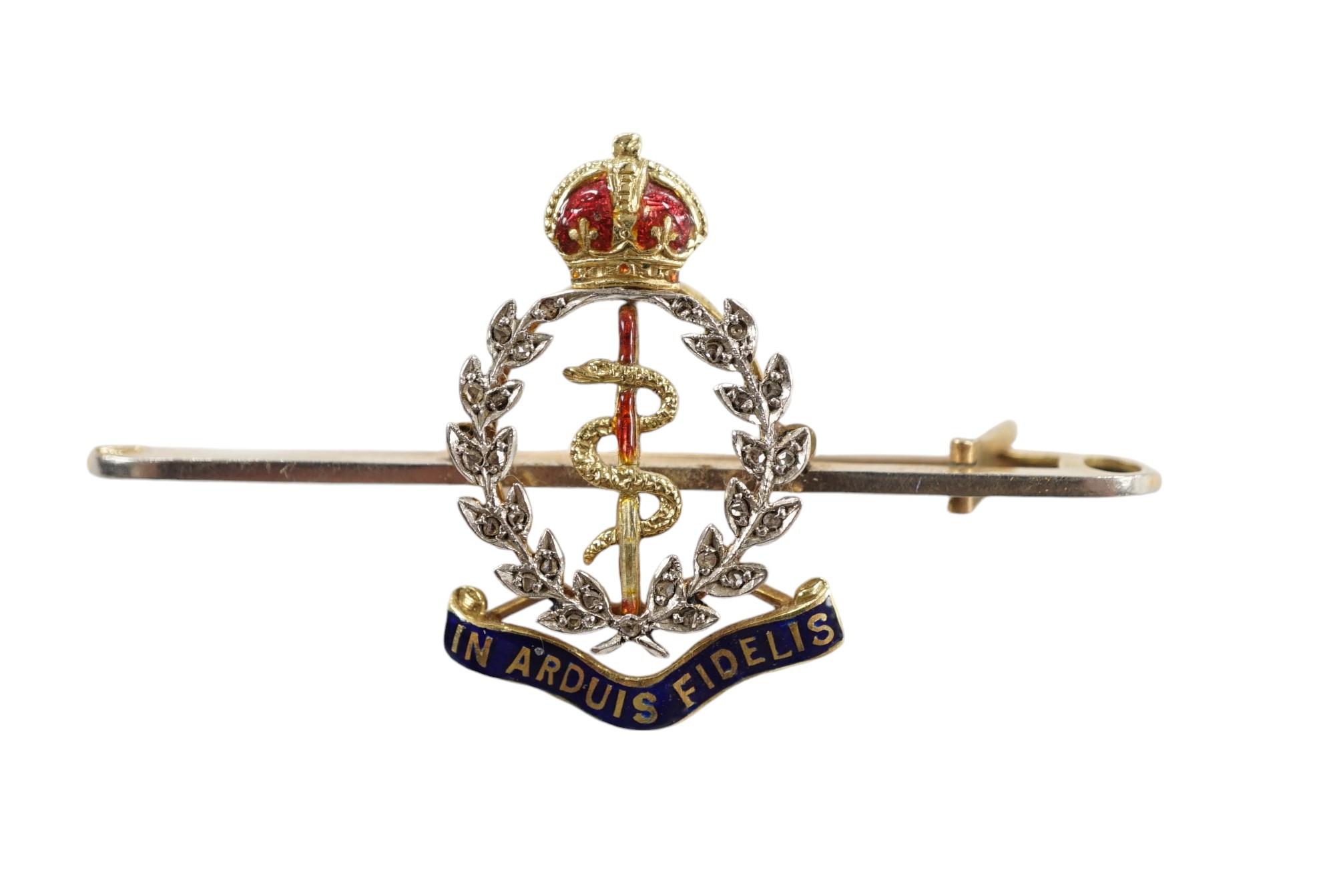 A mid 20th century 15ct, enamel and diamond set Royal Army Medical Corps sweethearts brooch, 49mm, gross weight 5 grams, in a Garrard & Co box. Condition - good